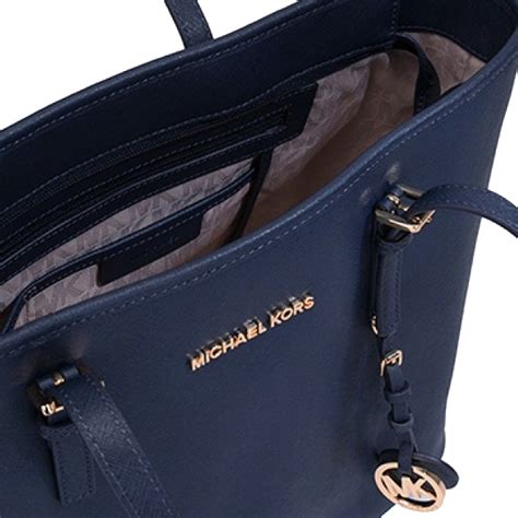 michael kors jet set travel top zip multifunction tote navy|Michael Kors bag with airplanes.